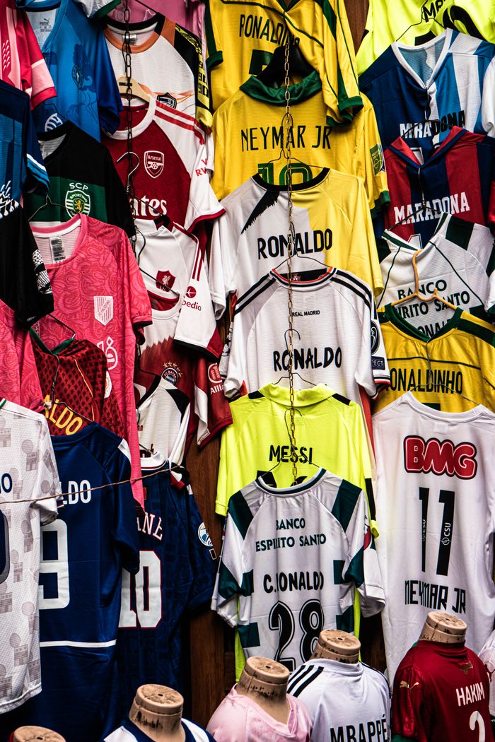 creative-02 Vibrant display of legendary football jerseys from global icons, perfect for sports enthusiasts.
